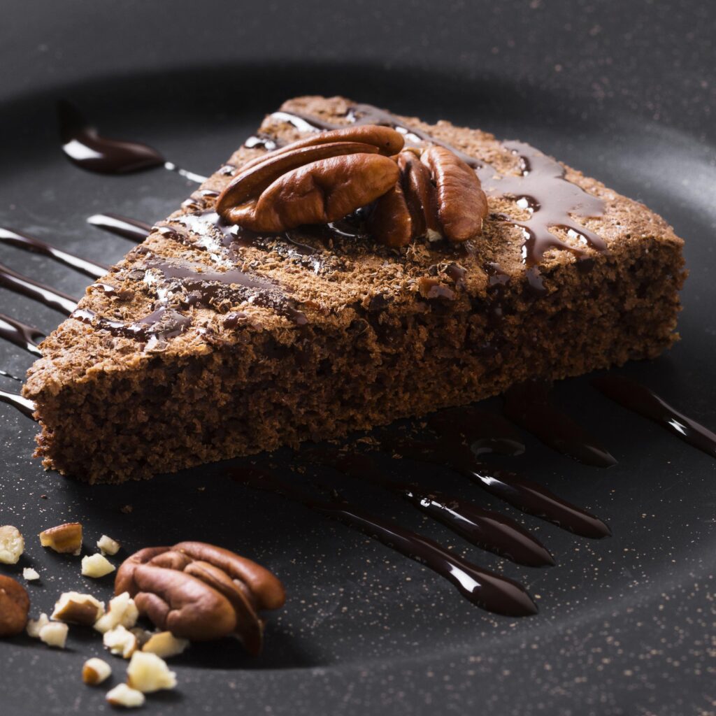 close up delicious chocolate cake with walnuts